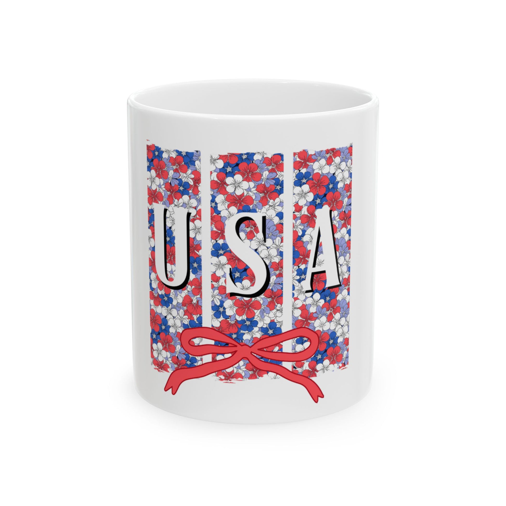 White mug with red, white, and blue floral pattern spelling USA.