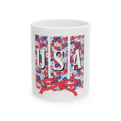 White mug with red, white, and blue floral pattern spelling USA.