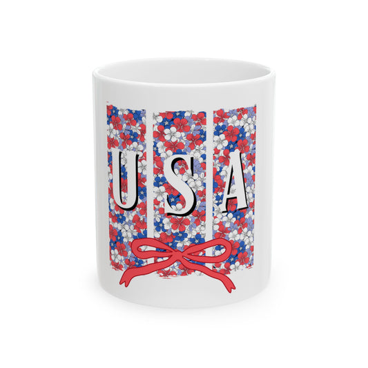 White mug with red, white, and blue floral pattern spelling USA.