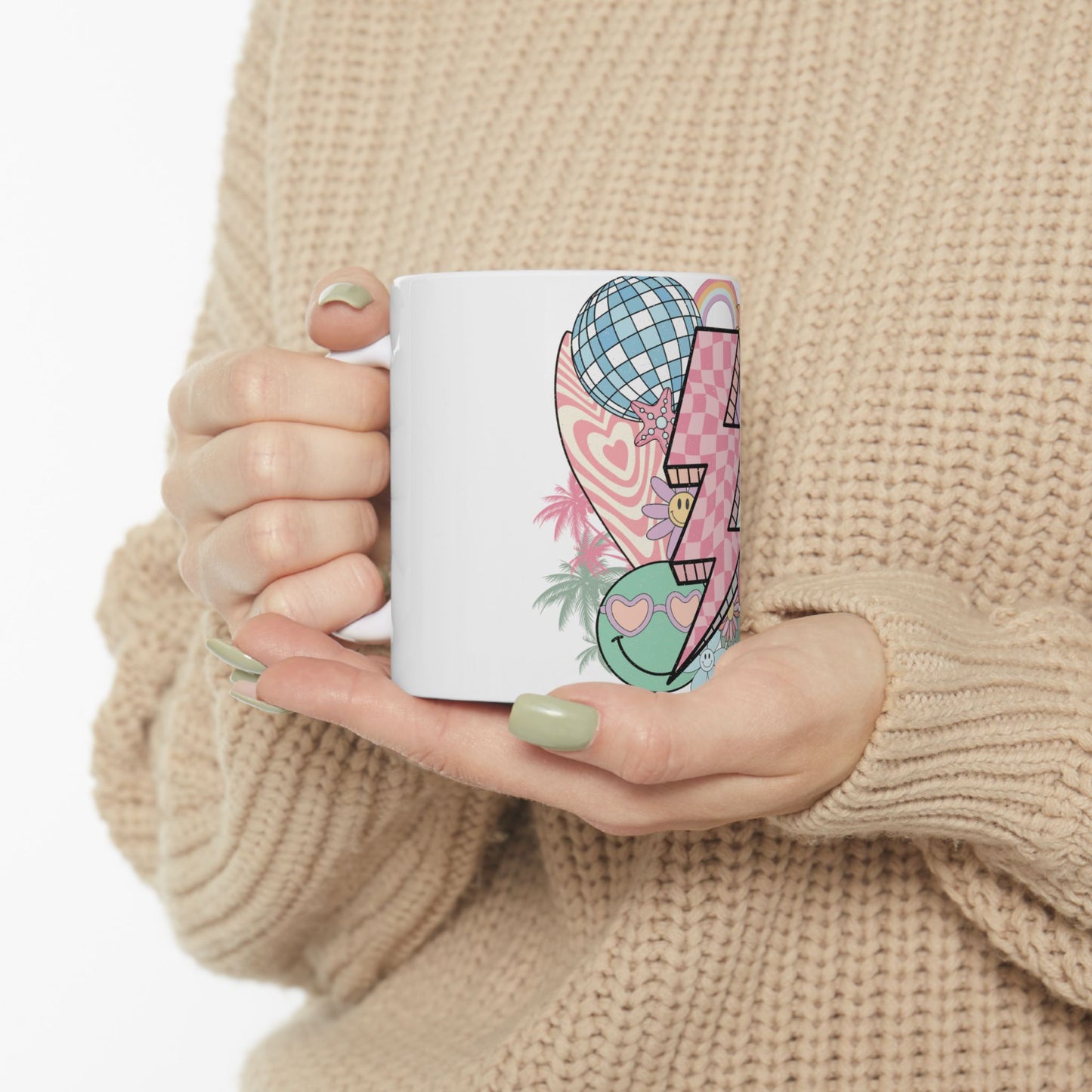 White mug with colorful retro graphic of disco ball, smiley face, and lightning bolt.