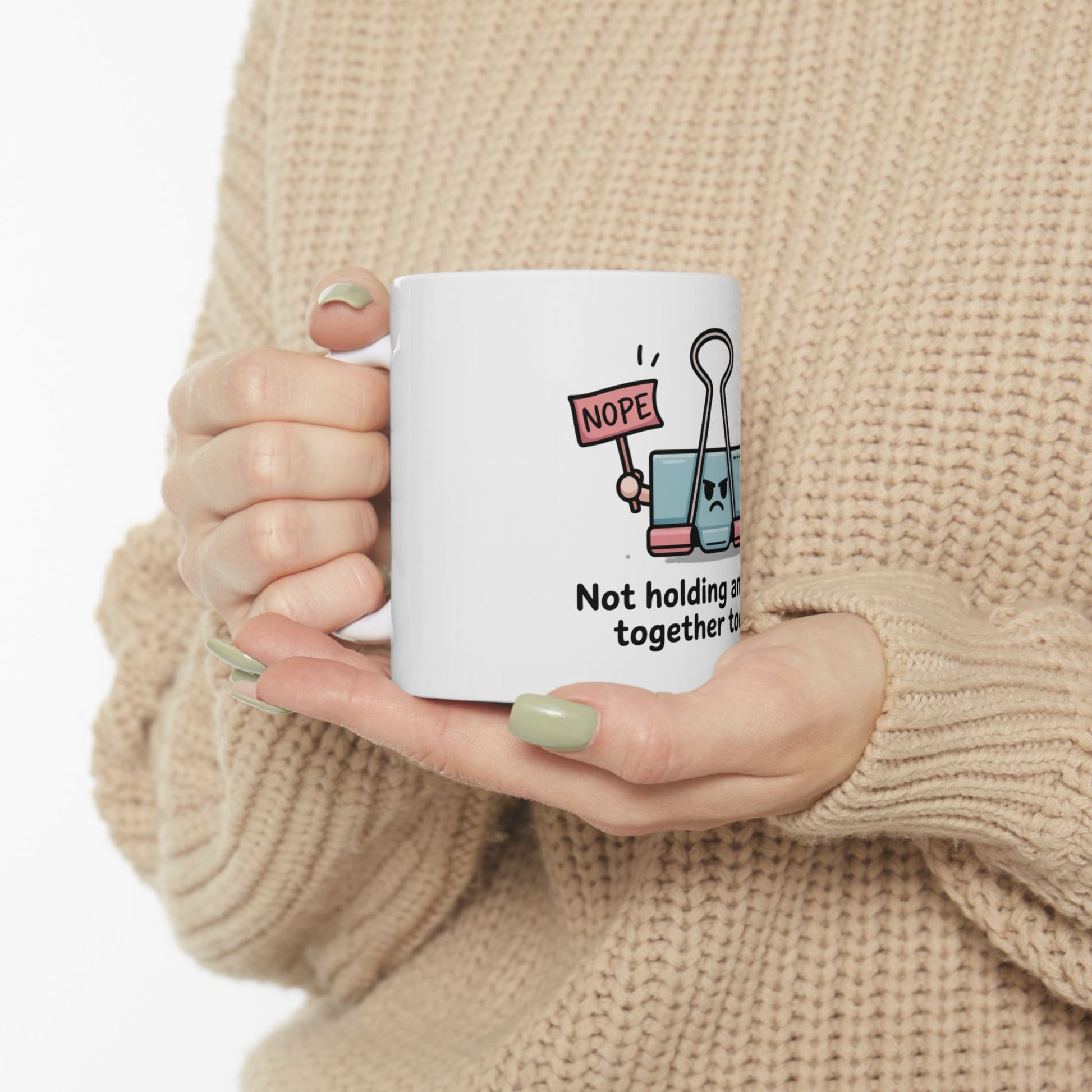 White mug with "Nope" binder clip character, saying "Not holding together".