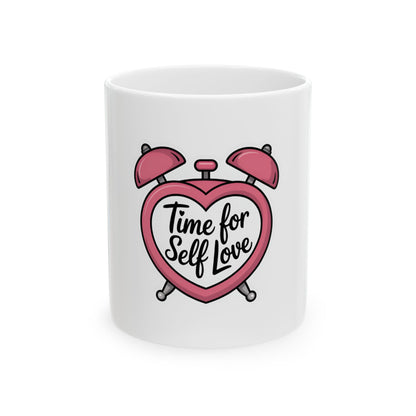 White mug with pink heart-shaped alarm clock and "Time for Self Love" text.
