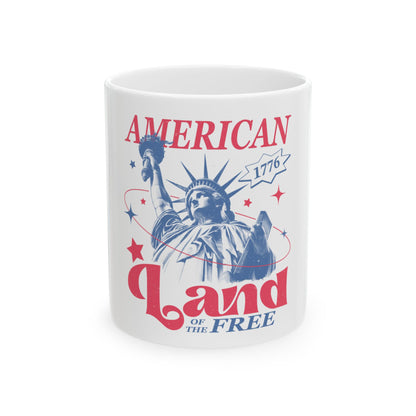Statue of Liberty graphic with "AMERICAN LAND OF THE FREE" text on a white mug.