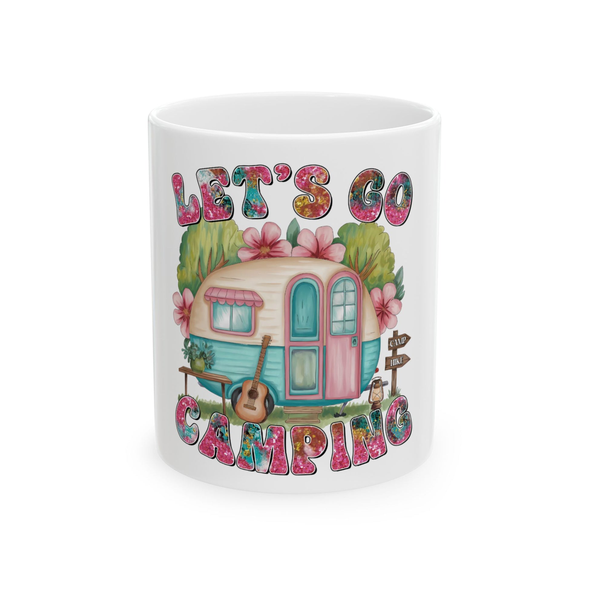 Ceramic mug with "Let's Go Camping" text and illustrated camper van.