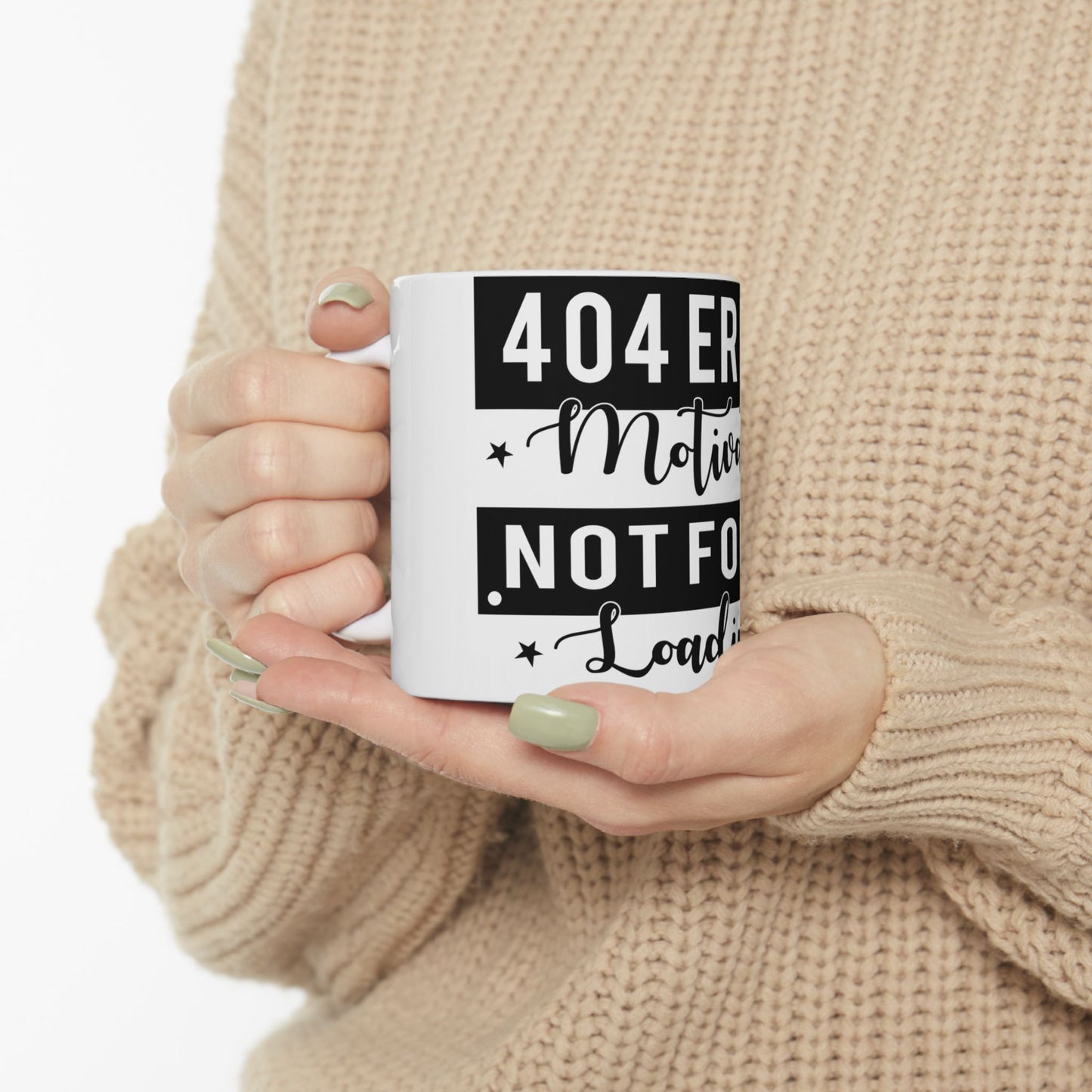 White mug with black text "404 Error: Motivation Not Found, Loading..." held by hands.