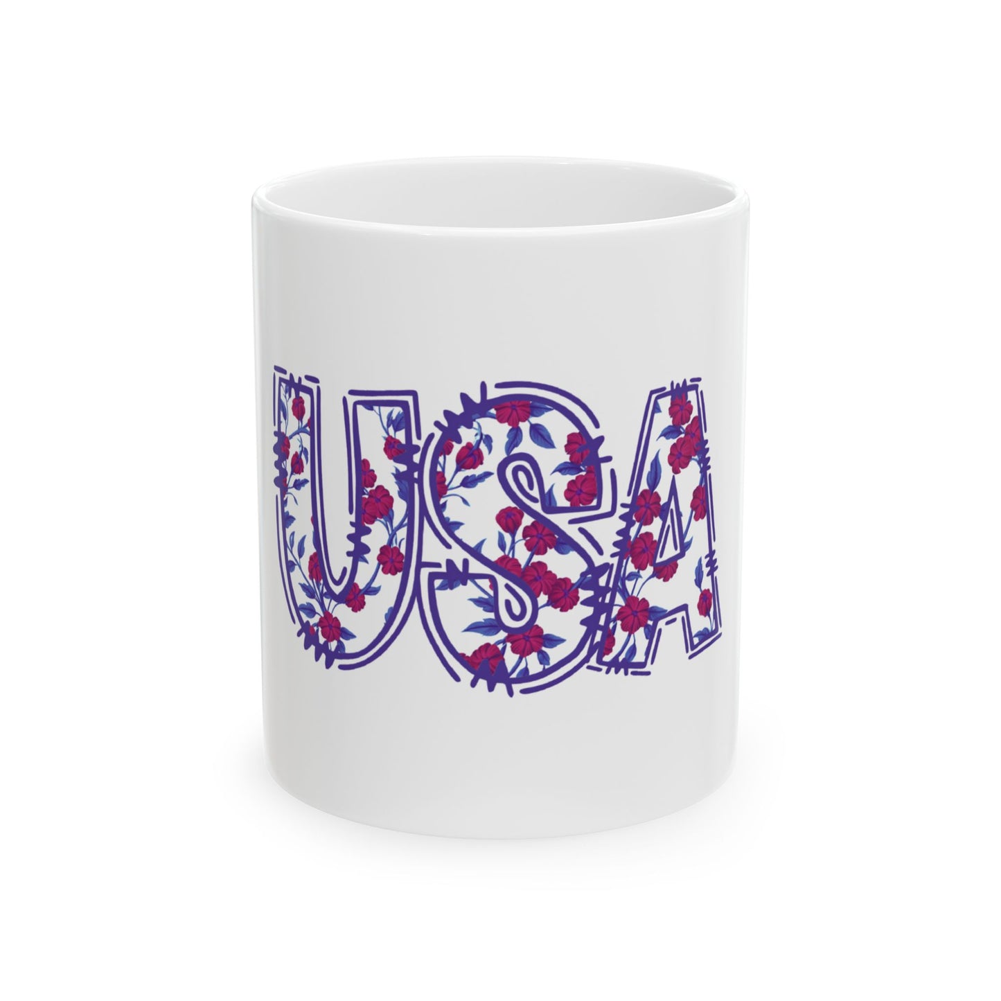 White mug with "USA" in a floral pattern of blue letters and red flowers.