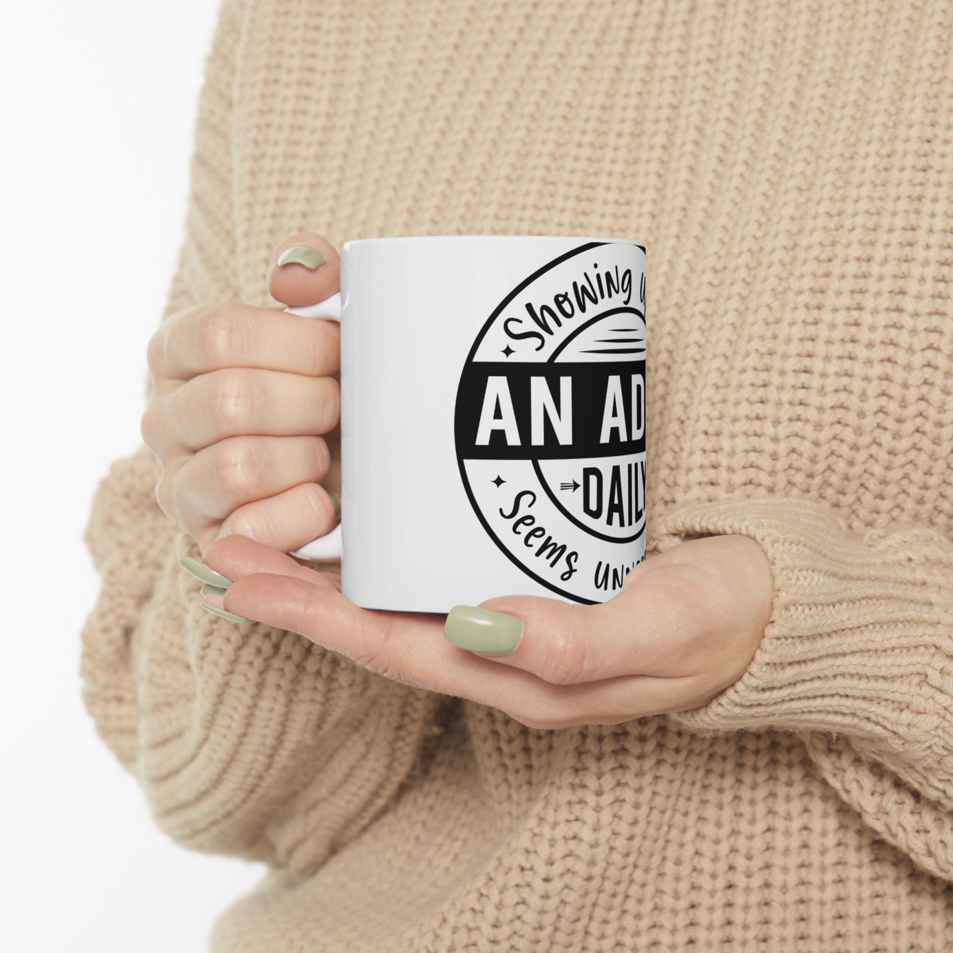 White mug with text "Showing an adult daily seems unavoidable".
