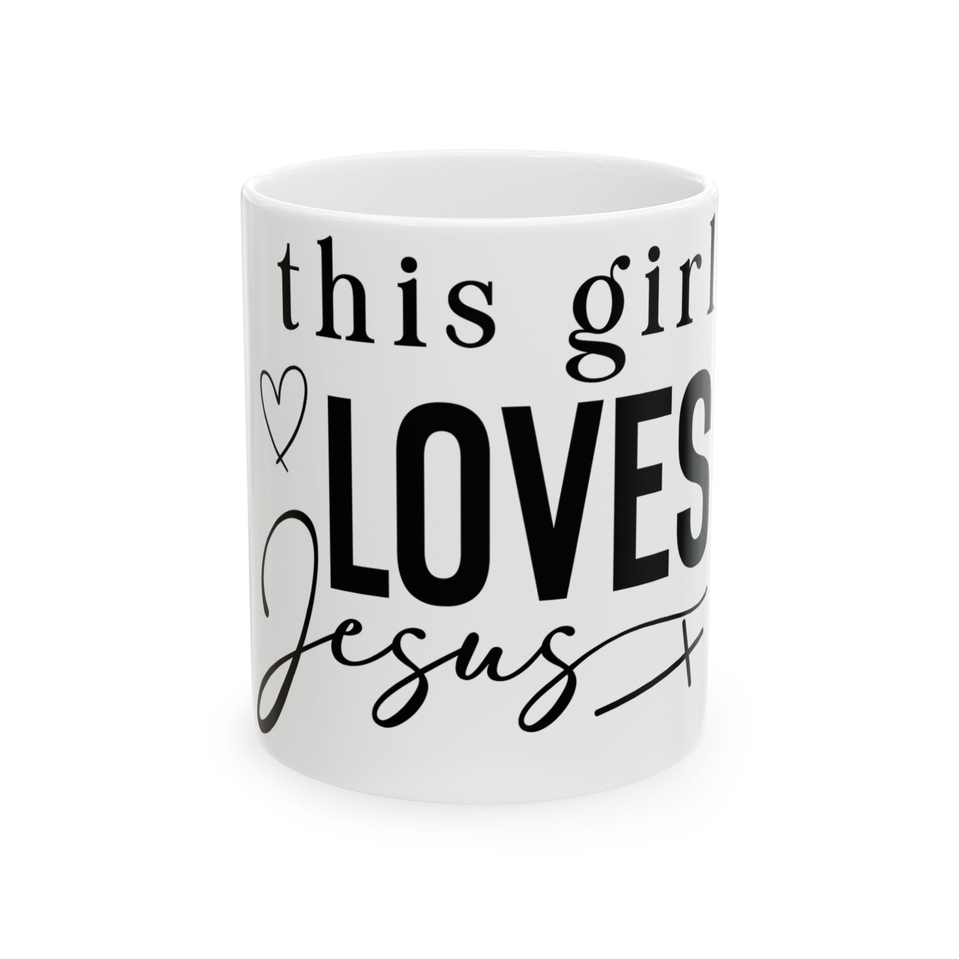 White mug with "This girl LOVES Jesus" in black lettering.
