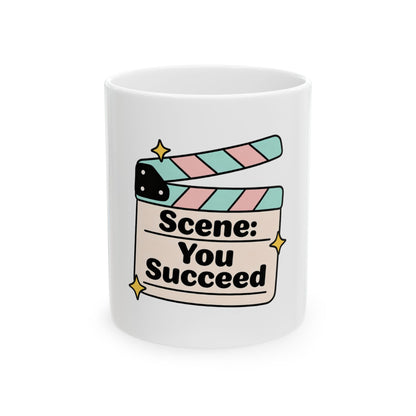 Mug with a movie clapperboard graphic that says "Scene: You Succeed."