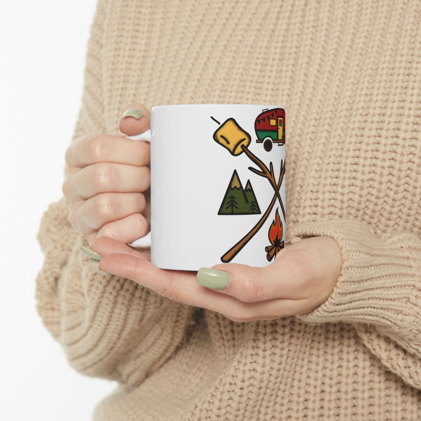 White mug with camping icons: campfire, marshmallows, tent, and trees.