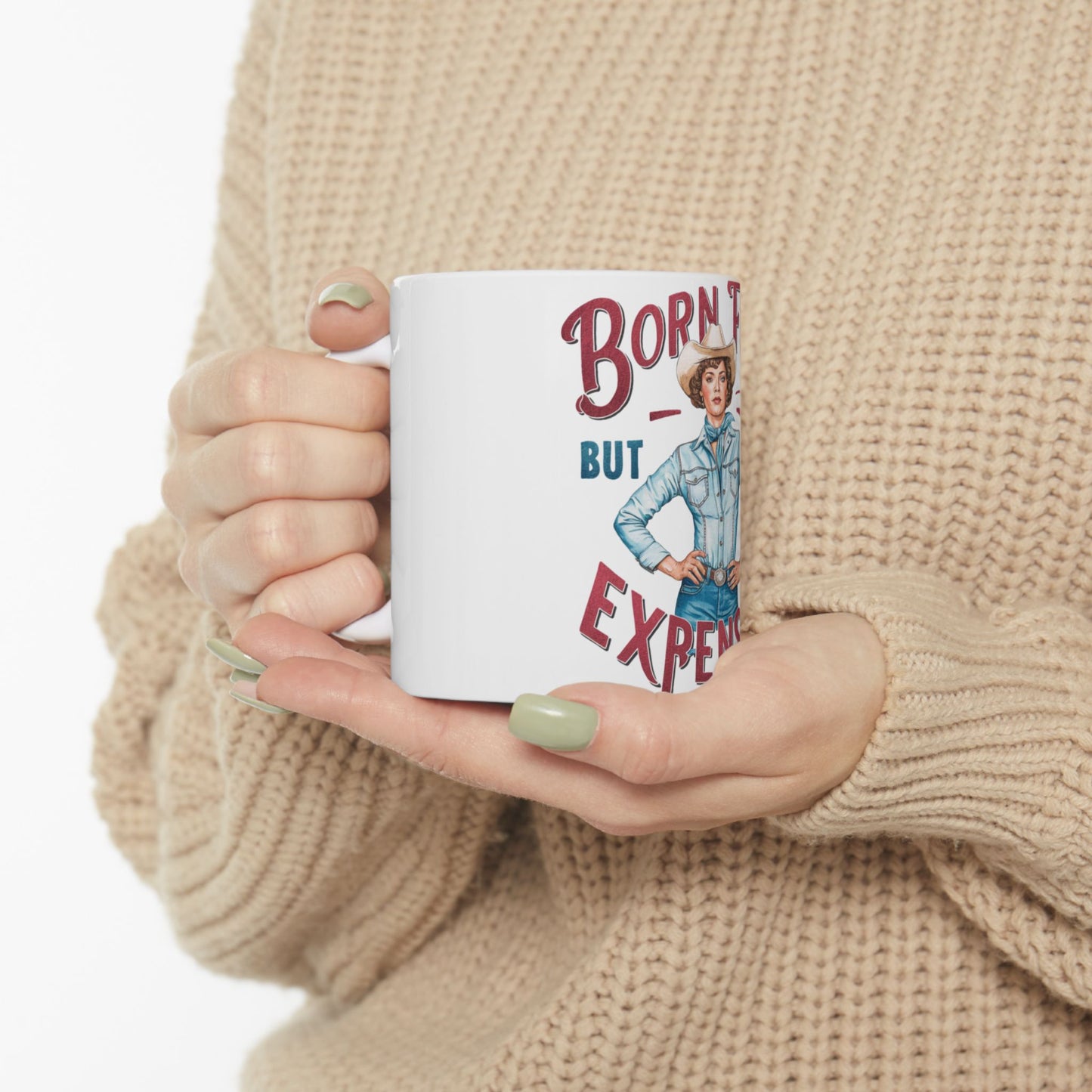 White mug with "Born Texas But Expensive" text and cowboy illustration.