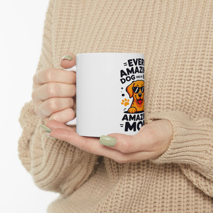 White mug with cartoon dog and text: "Every amazing dog has a mom".