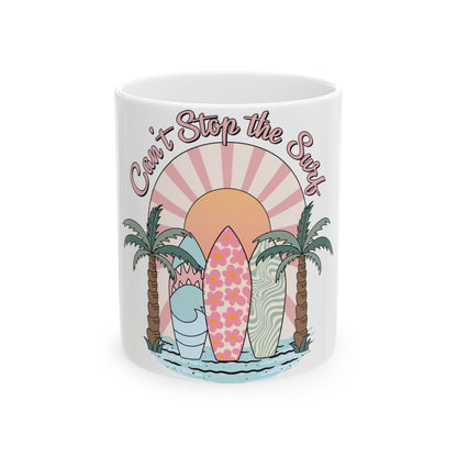 Mug with "Can't Stop the Surf" text, surfboards, palm trees, and a sunset.