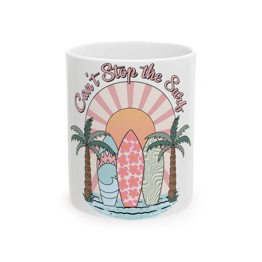 Mug with "Can't Stop the Surf" text, surfboards, palm trees, and a sunset.